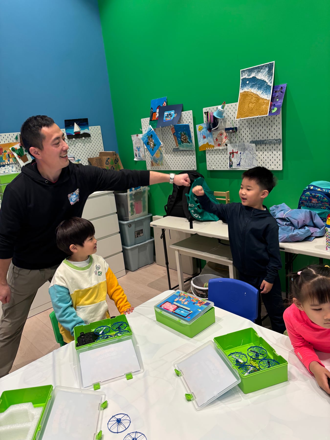 An instructor and students celebrating progress together in class